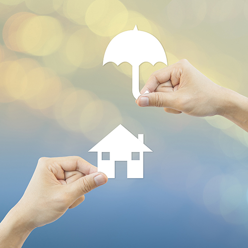 Business concept Hand hold white paper house and umbrella bokeh